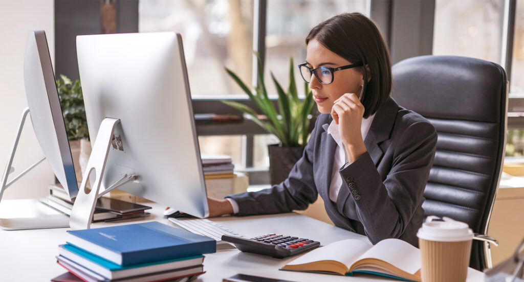 a certified public accountant working on a computer